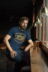 Heather Ringer Tee Mockup Of A Man Drinking A Beer In A Bar 27930 - Stickersandmore.com