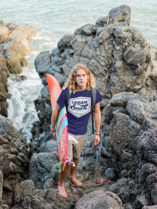 Surfer Dude Wearing A T Shirt Mockup On The Rocks A18801 - Stickersandmore.com